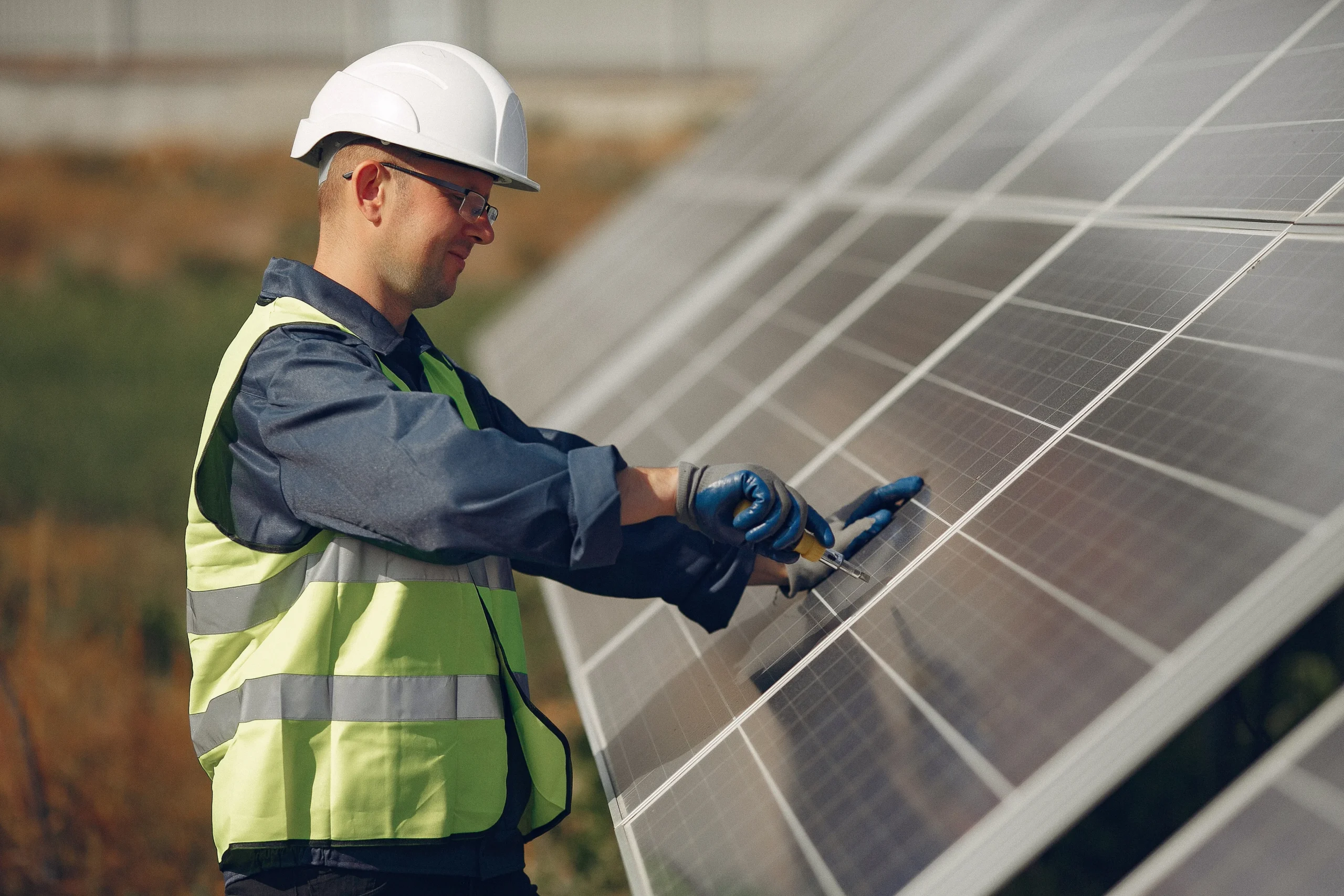 Solar technician inspecting solar panels in Perth